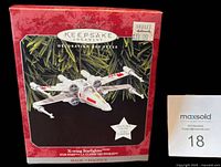 Front of box showing Hallmark Keepsake X-Wing Starfighter ornament