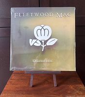 Front cover of sealed Fleetwood Mac Greatest Hits LP on stand