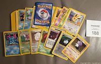 Full spread of all 31 Pokémon cards showing assortment and condition