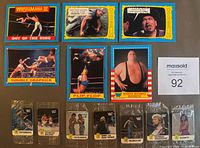 Front view showing six 1987 blue-border WWF trading cards and seven sealed Hostess sticker packs