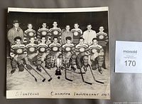 Front of 1943 team photo with players, trophy, handwritten caption