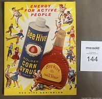 Front cover with Bee Hive syrup graphics and sports imagery
