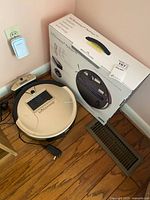 Top view of bObsweep PetHair vacuum, dock, box