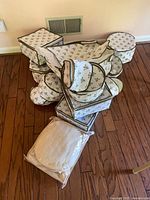 Group of quilted round and square china storage containers, plus sealed package