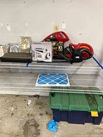 Overall view of lot on shelving showing all listed items