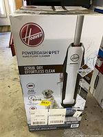 Front of sealed Hoover PowerDash Pet box showing branding and product image