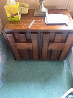 Pair of wooden nightstands with block-front design, top view