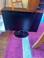 Front view of Samsung television on stand