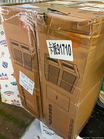 Sealed cardboard carton with illustration of storage unit and label 91710