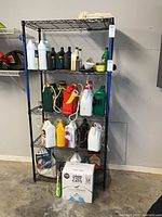 Front view of entire black metal wire shelving unit with five shelves