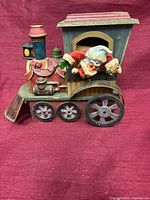 Full view wooden locomotive with Santa figure