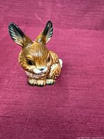 Front view of glazed porcelain rabbit figurine