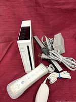 Console, remote, cables visible