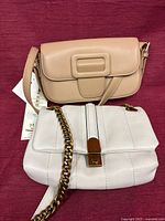 Beige crossbody and white Nine West purse front view