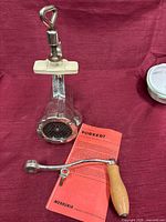 Full set showing grinder body, crank, clamp and manual