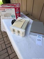 Overall view showing EXP drive in foam, Sony drive, backpack box and power adapter