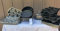 Full lot showing baking pans, molds, glassware and cloche
