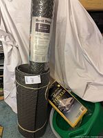 Rolled Best Step mat, sealed and open, towels pack, green pan visible