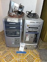 Front view of two HP Pavilion desktop towers side by side