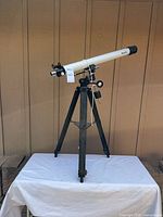 Full view of Meade refractor telescope on tripod