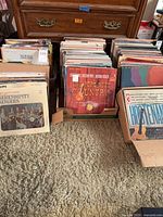 Two open boxes and drawer full of vinyl LPs, sleeves facing forward; Serendipity Singers and Pops Goes Country clearly visible