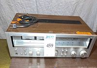 Front and top view of receiver with accessory cord visible