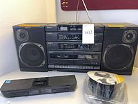 Front view of Sony CFD-460 boombox with iHome iP46 dock and MacAlly mTune headset