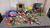 Overall lot showing all toys on table