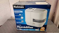 Sealed retail box front showing Holmes Cool Mist Humidifier HM3500