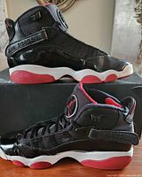 Side profile of both shoes on box