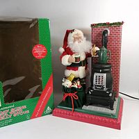 Full scene with box showing Santa, stove, chimney on red-green base