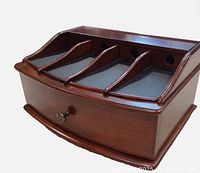 Front angled view showing device slots, drawer and finish