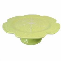 Side view showing light green cabbage leaf cake stand on pedestal