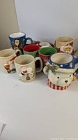 Group view of all nine holiday mugs