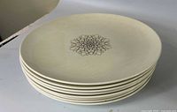 Stack of eight Desert Star dinner plates