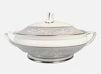 Side view of Royal Doulton Valleyfield covered casserole showing pattern, handles, pedestal base