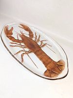 Full view of oval glass platter with lobster design