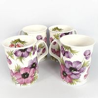 Four Roy Kirkham Anemone mugs grouped