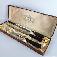 Full view of three-piece carving set in lined case