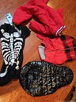 All five dog apparel items laid out