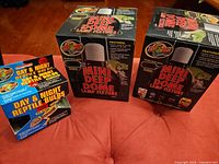 Boxes and items: two Mini Deep Dome fixture boxes and Day & Night Reptile Bulbs box