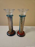 Front view of both Cancan candlesticks upright
