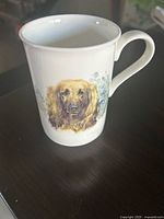 Front view of bone china mug showing Afghan Hound portrait and handle