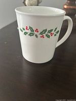 Mug front showing holly pattern