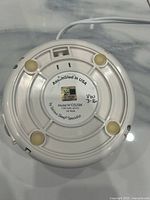 Underside label of Dohm white noise machine showing model and electrical specs