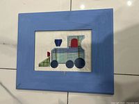 Helicopter fabric appliqué framed art in blue painted wood frame