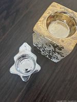 Silver and gold ceramic tealight holders top view showing recesses