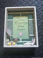 Front view of tennis-themed 5x7 shadow box frame