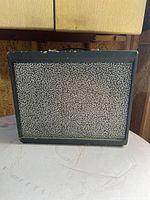 Front view showing grille cloth and cabinet condition