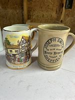 Two steins: multicolour street scene and tan Joseph Smith Sheffield
